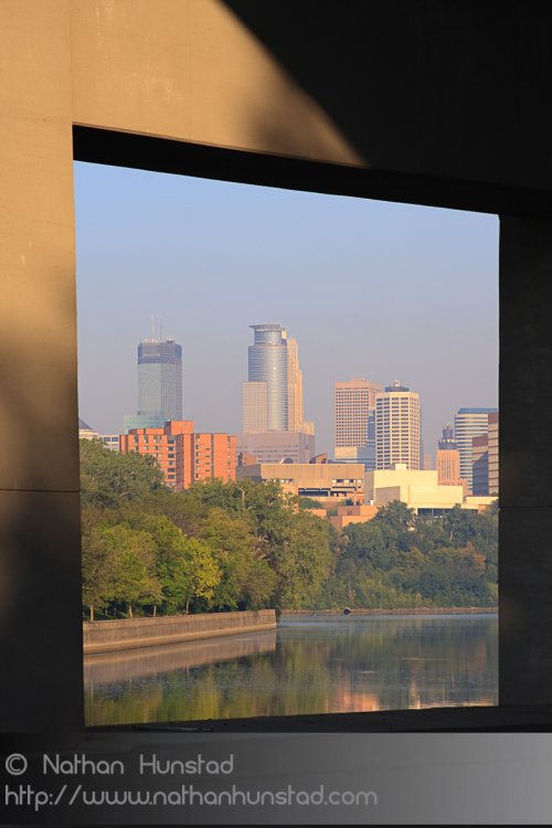 A bridge pier for the Dartmouth Bridge frames downtown Minneapolis.